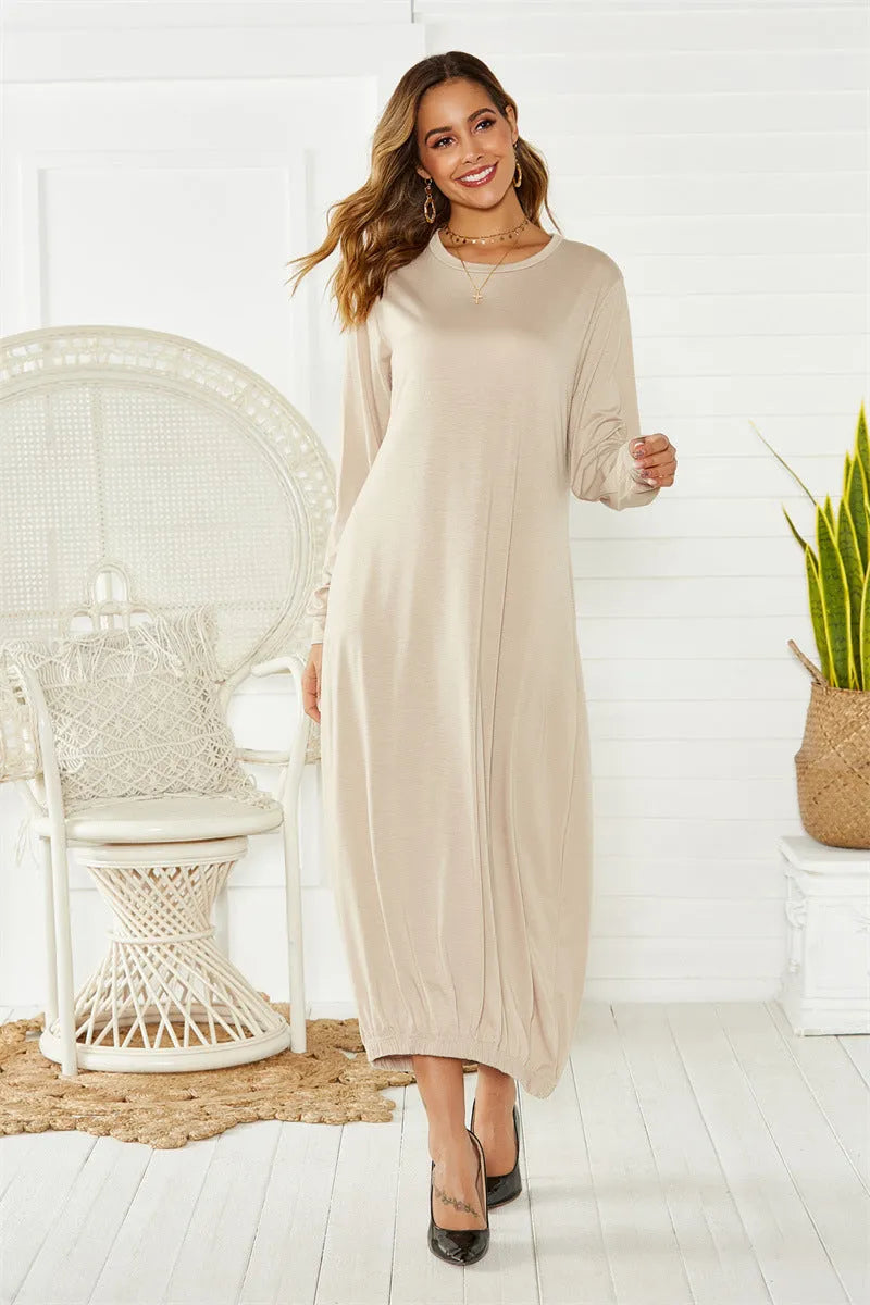 Black loose lantern dress with lace-up crew neck and elastic waist.