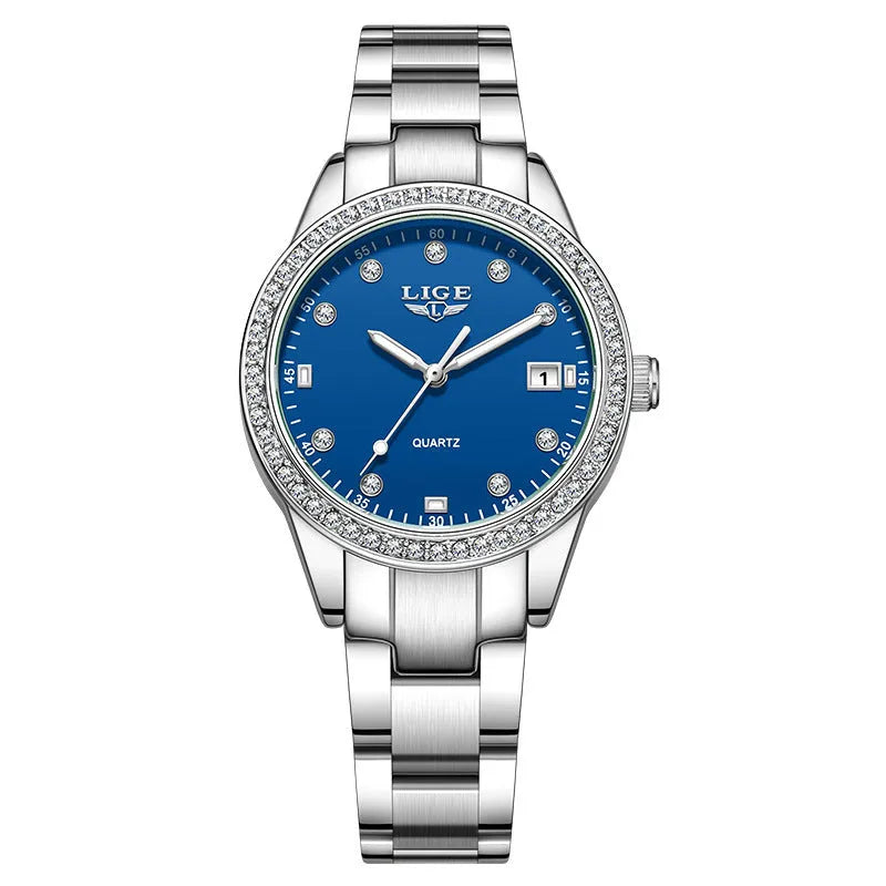 Women's silver fashion watch with diamond bezel, round white dial, luminous hands, and stainless steel bracelet.