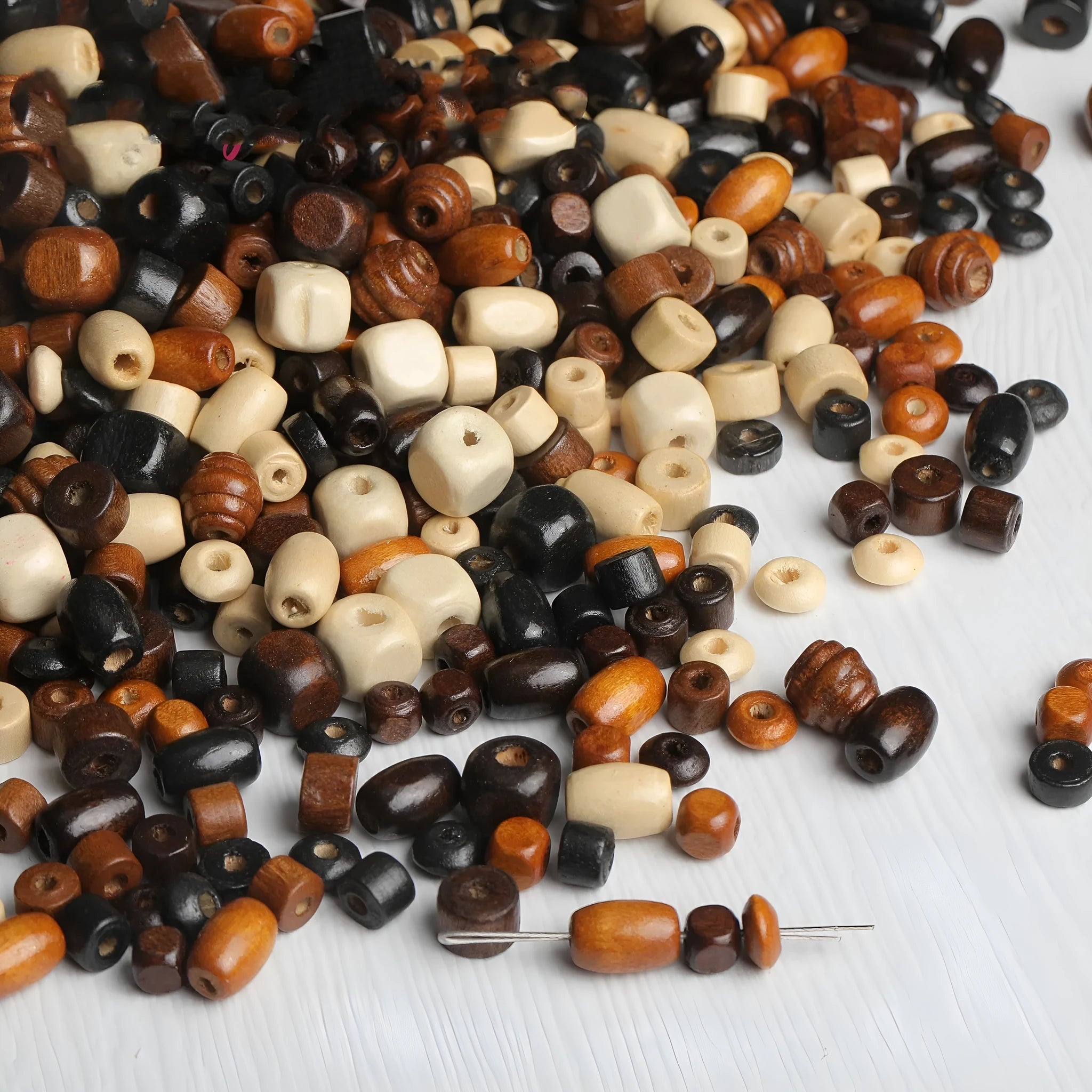 Mixed colour vintage solid wood beads in a 10g pack for DIY jewellery making.