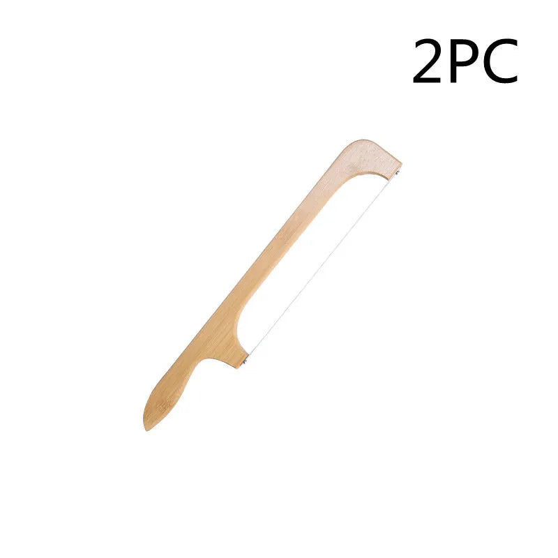 Wooden serrated bread knife with 40cm blade on a cutting board next to a loaf of bread