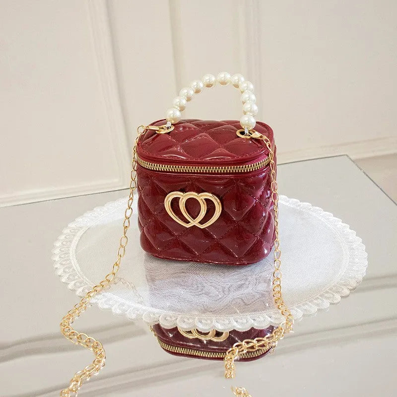 PVC bucket-shaped gel bag for women with a heart pattern, shown in apricot colour.