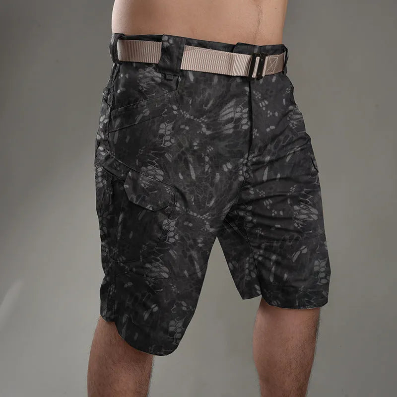 IX7 men's tactical shorts in cotton blend fabric shown in a camouflage colour, featuring a button fly.