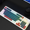 Colourful USB keyboard with luminous backlighting on a desk, showing mechanical-feel keys.