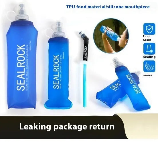 Grey portable water filter straw with textured grip and long flexible silicone tube, shown with a carabiner clip.