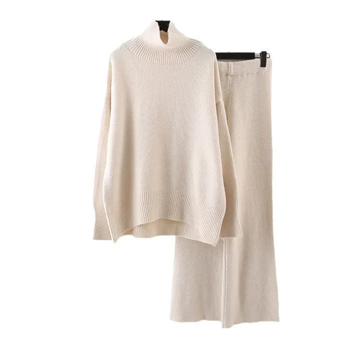 Women's beige acrylic sweater and wide-leg trousers two-piece set laid flat.