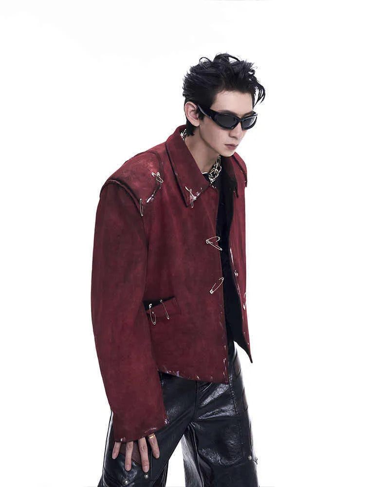 Red men's loose-fit quilted jacket with lapel collar and decorative pin flocking detail.