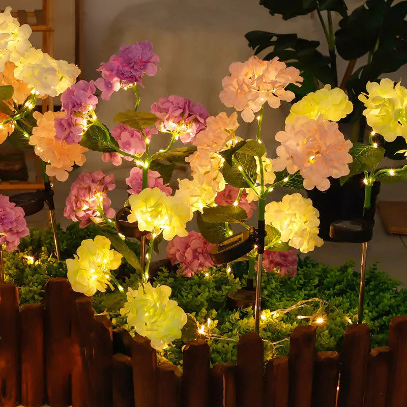 Solar hydrangea garden decorative light in garden setting with floor outlet placement