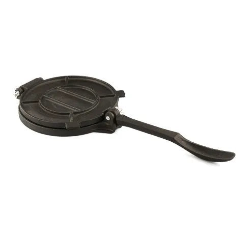 Round cast iron hand pressure cake press on a kitchen surface, available in sizes 16.5cm to 26cm diameter
