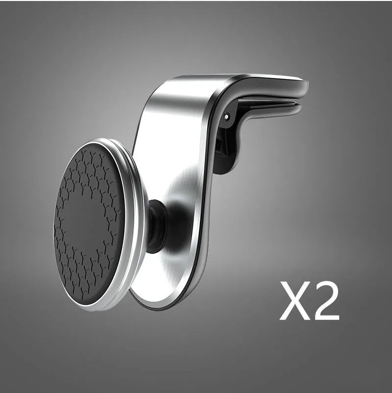 Car phone bracket mounted on vehicle air vent in silver finish showing rotation adjustment