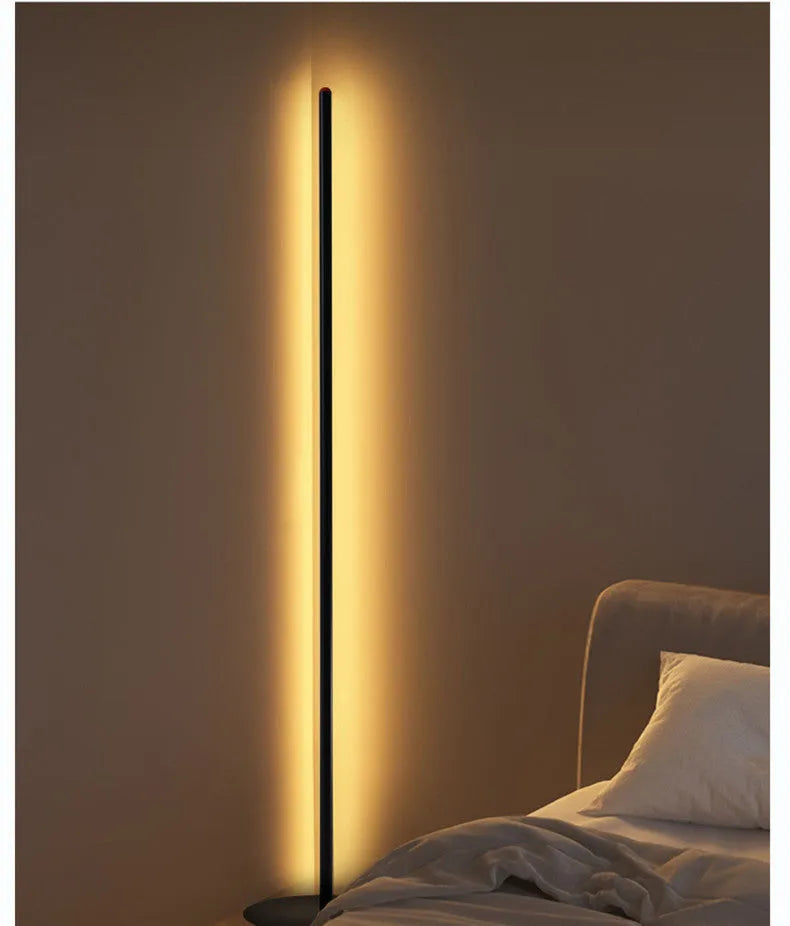 Modern simple vertical aluminium alloy floor lamp in three height sizes on a plain background.
