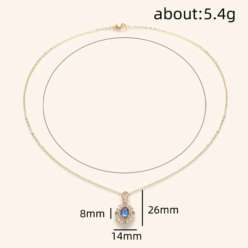 Yellow gold-tone women's necklace with adjustable box chain and a gemstone pendant featuring a central inlaid zircon.